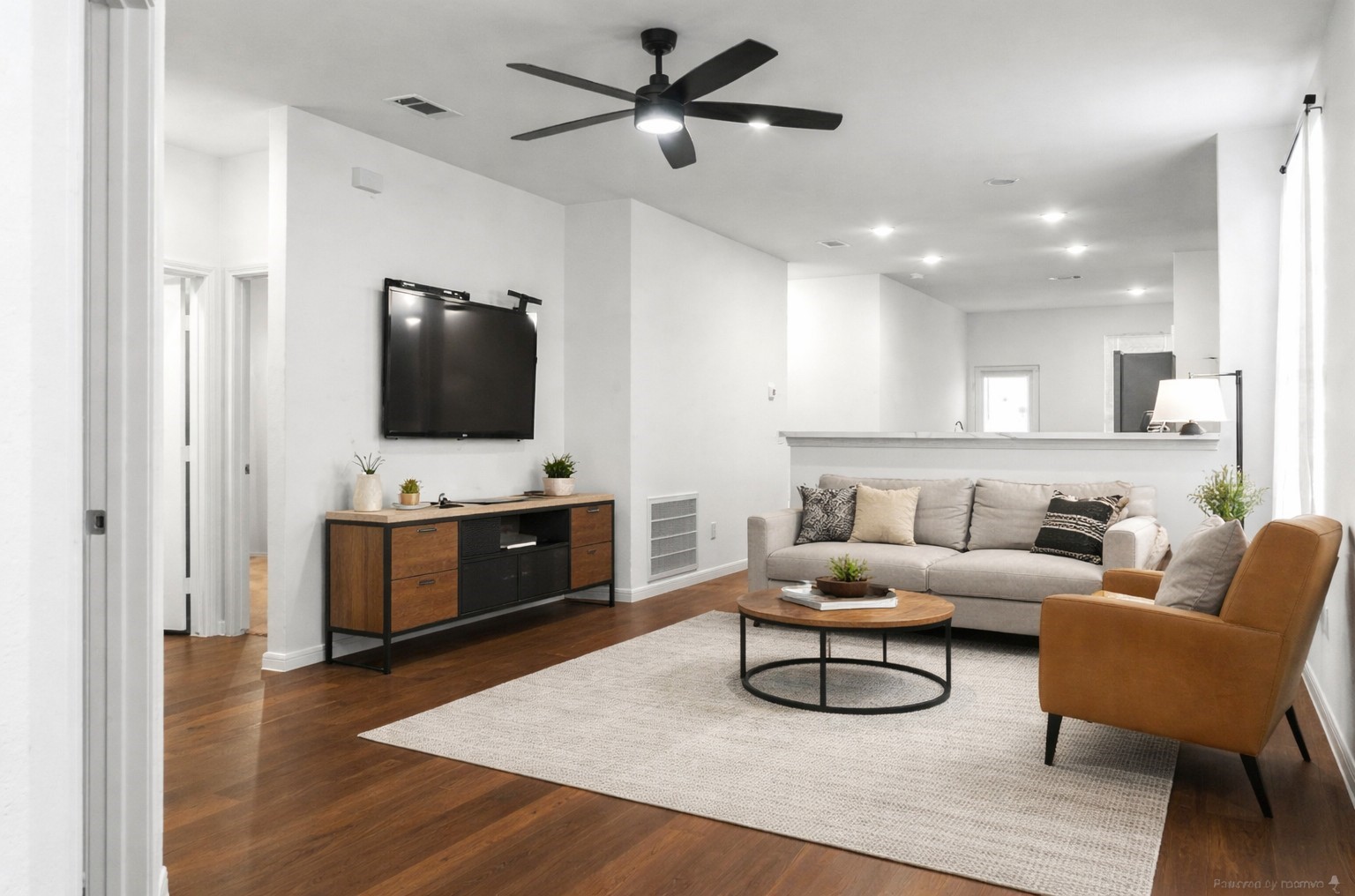 10222 Clearwick Street Houston, TX 77034 - Photo 7 of 28 a living room with furniture and a flat screen tv