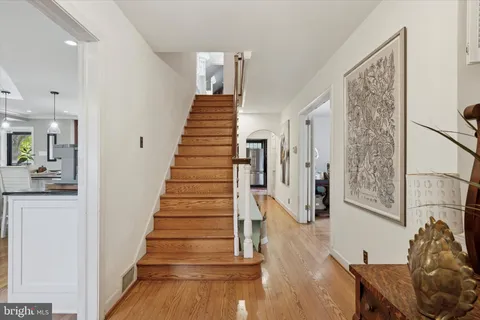 a view of a hallway with paintings on the wall