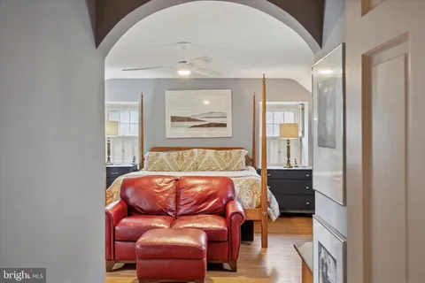 a room with a table chairs and entryway