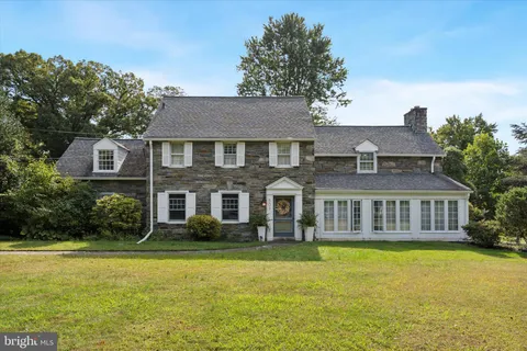a front view of a house with swimming pool