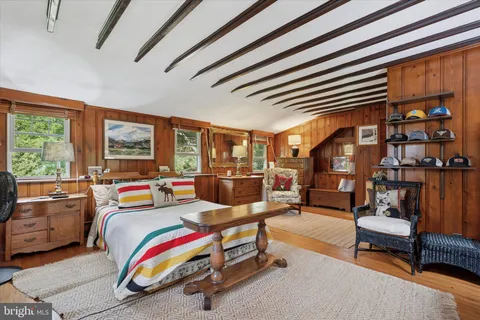 an aerial view of a house with swimming pool and garden