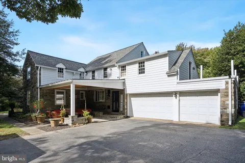 an aerial view of a house with a ocean view