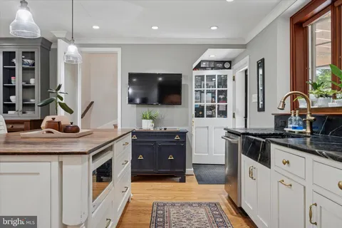 a kitchen with a sink stove and refrigerator