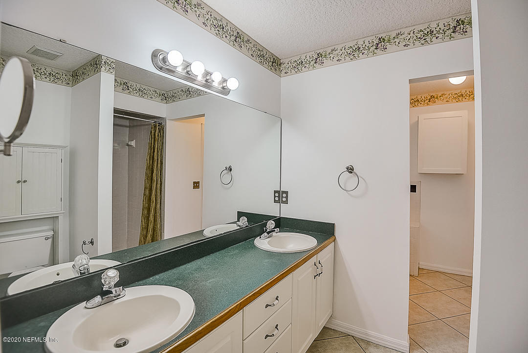 115 Beechwood Road St. Augustine, FL 32086 - Photo 12 of 28 a bathroom with a sink and a mirror