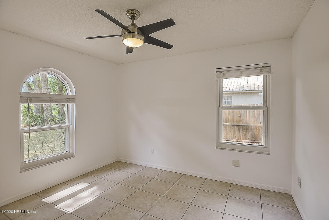 115 Beechwood Road St. Augustine, FL 32086 - Photo 19 of 28 a view of an empty room with a window