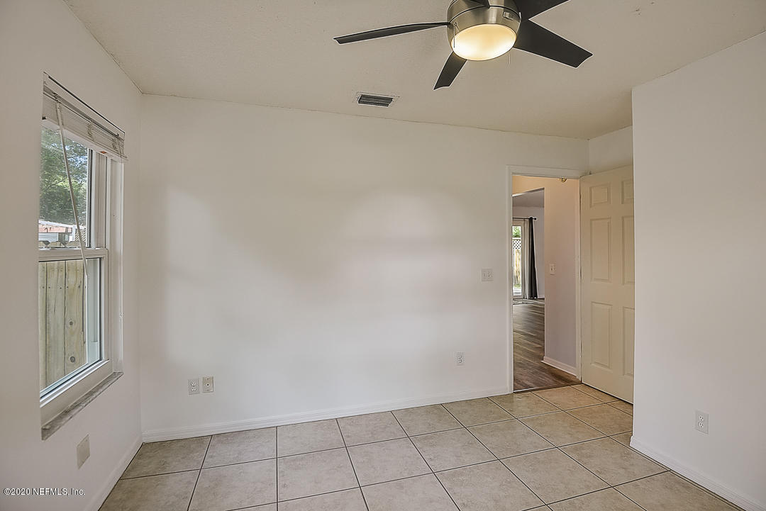 115 Beechwood Road St. Augustine, FL 32086 - Photo 20 of 28 a view of an empty room with a window