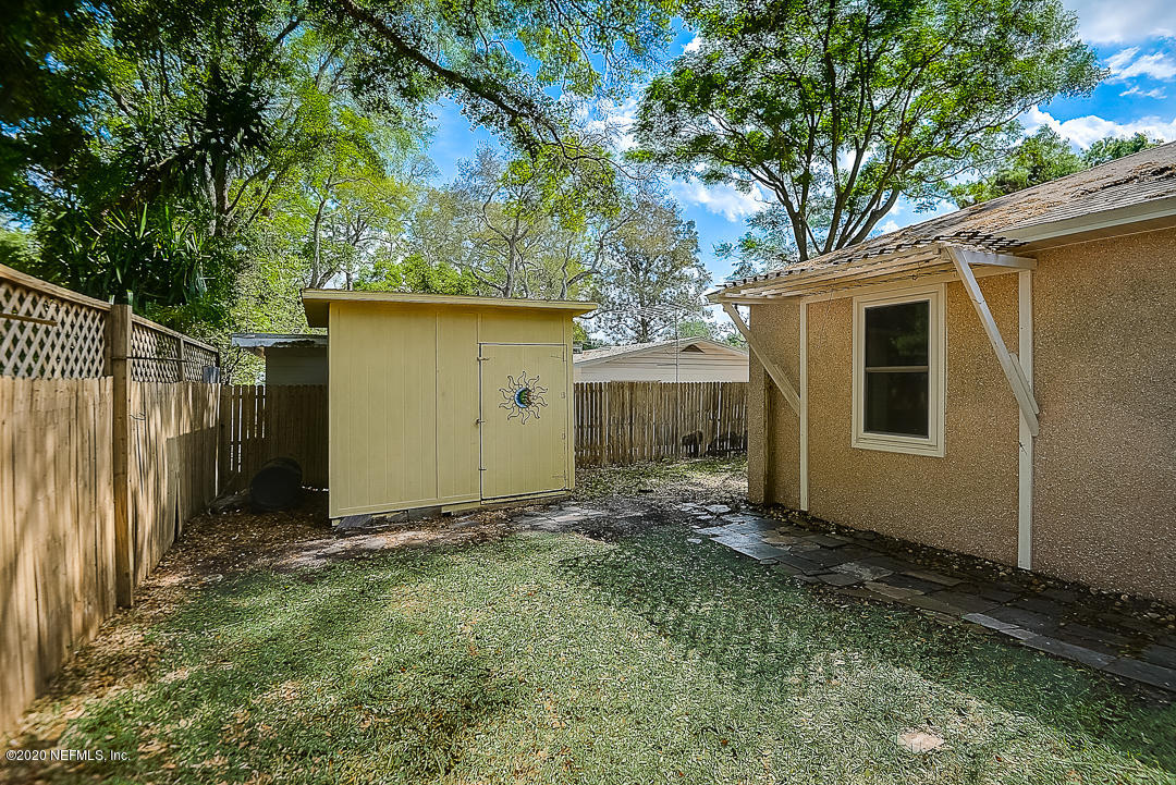 115 Beechwood Road St. Augustine, FL 32086 - Photo 23 of 28 a backyard of a house with lots of green space