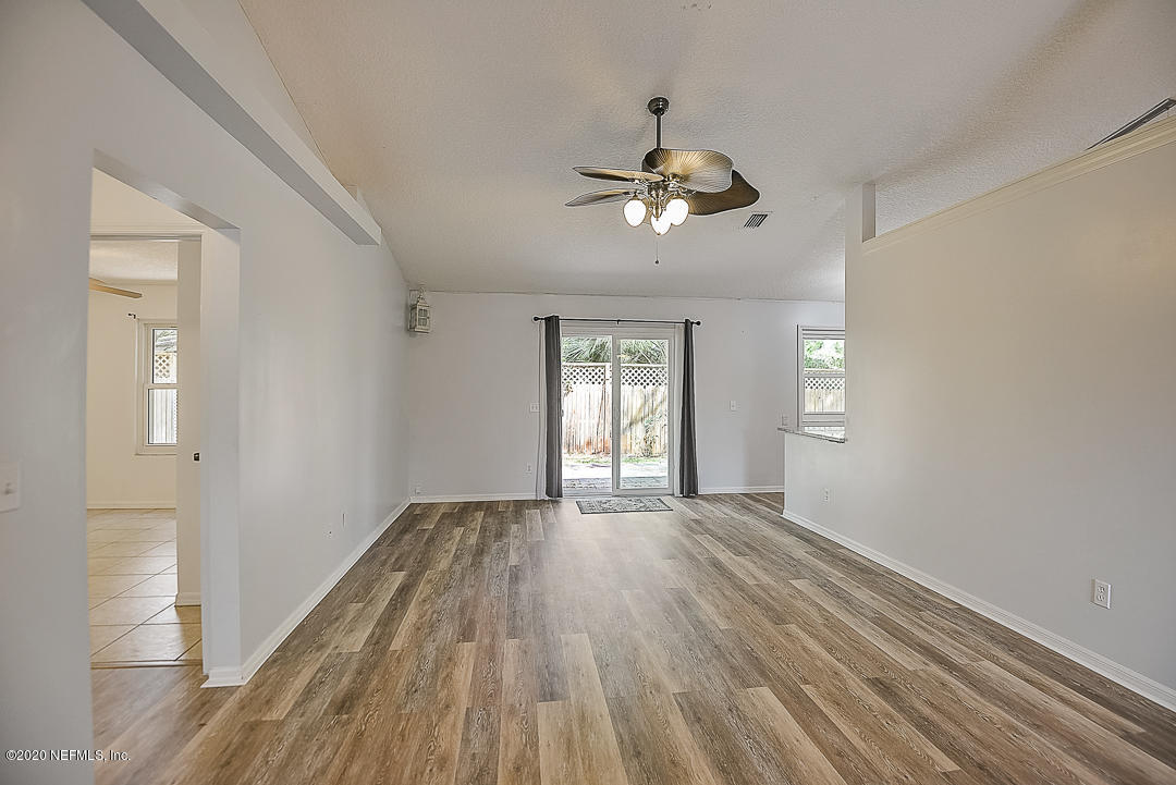 115 Beechwood Road St. Augustine, FL 32086 - Photo 4 of 28 a view of empty room with wooden floor and fan