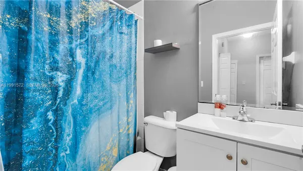 a bathroom with a sink and toilet