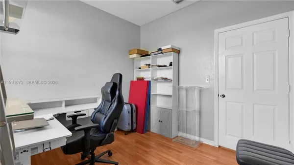 a workspace with furniture and a window