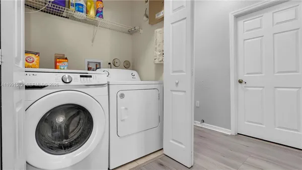 a utility room with dryer and washer