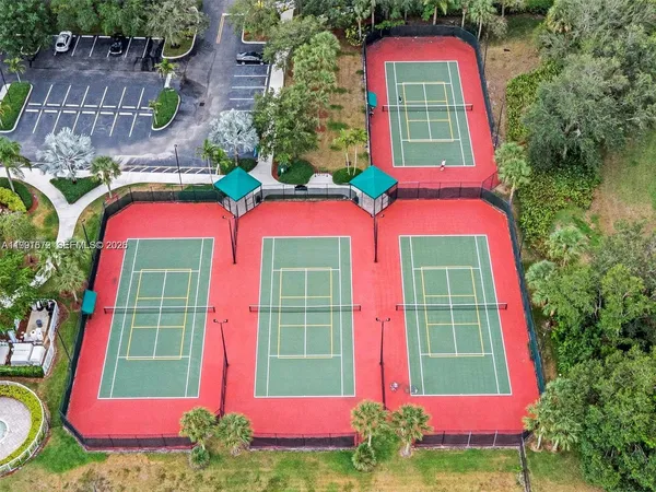 a front view of multi story residential apartment building with yard