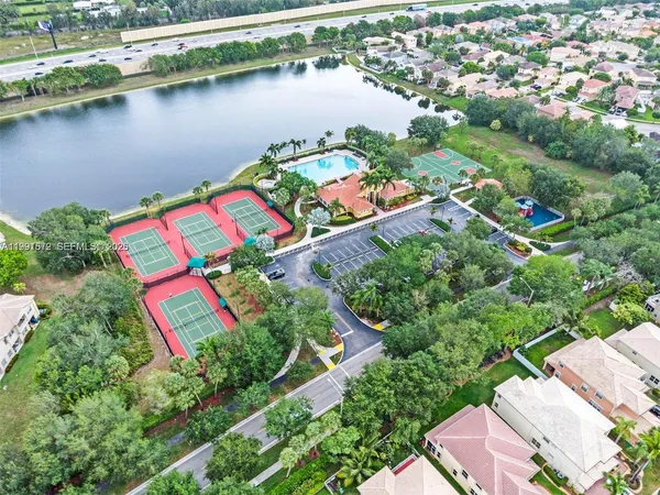 an aerial view of lake residential houses with outdoor space and lake view