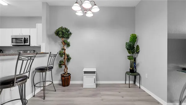 a view of a dining room with furniture wooden floor