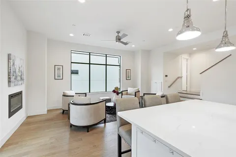 a large room with a large window and furniture