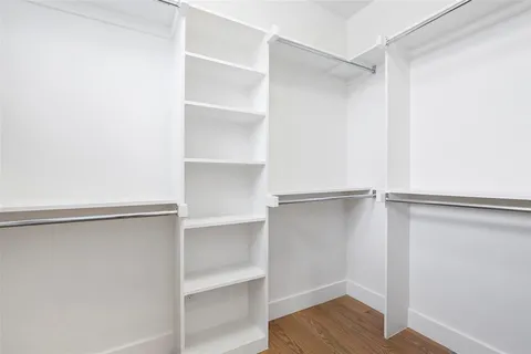 a view of an empty walk in closet