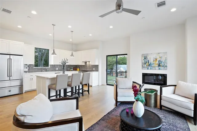 a living room with furniture and a potted plant
