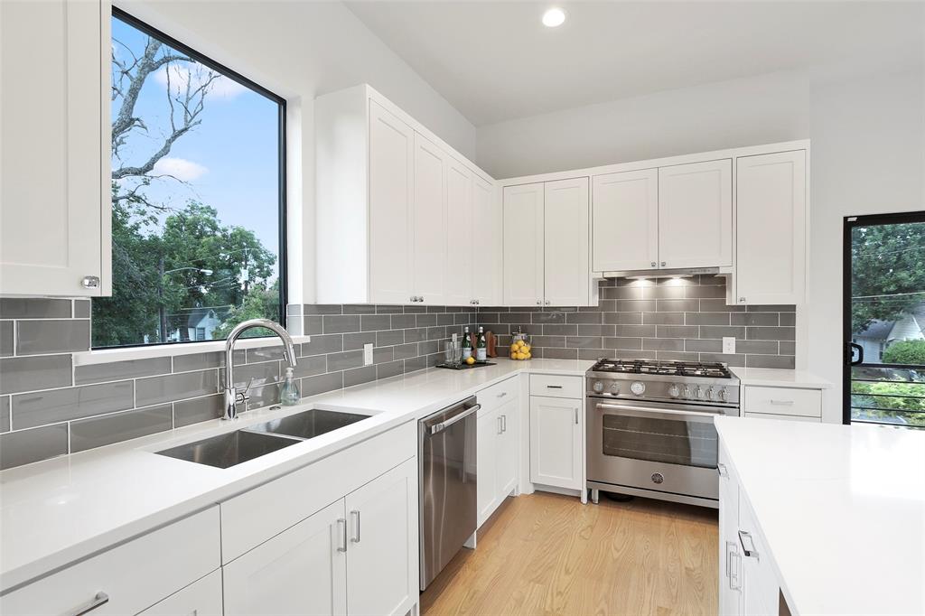2307 Kirby Street, Unit B Dallas, TX 75204 - Photo 9 of 28 a kitchen with a sink cabinets and stainless steel appliances