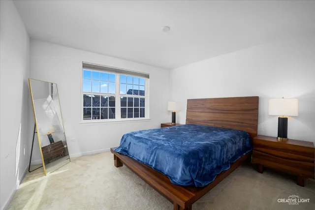a bedroom with a bed and window