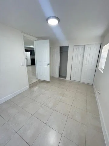 an empty room with a bathroom