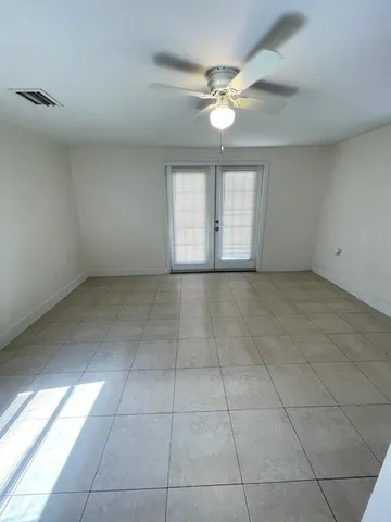 a view of an empty room with a window