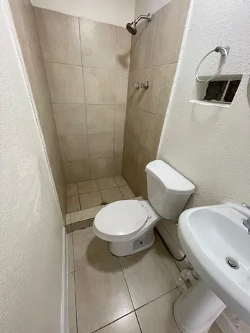 a bathroom with a toilet and a sink