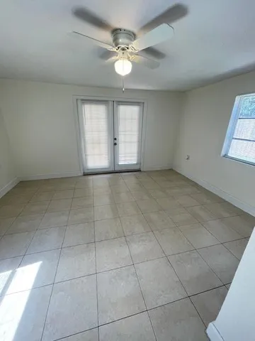 a view of an empty room with a window