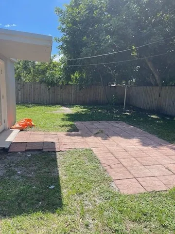 a backyard of a house with lots of green space