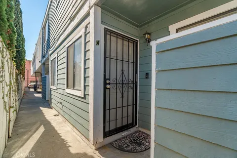 a view of a house with a door and wooden floor