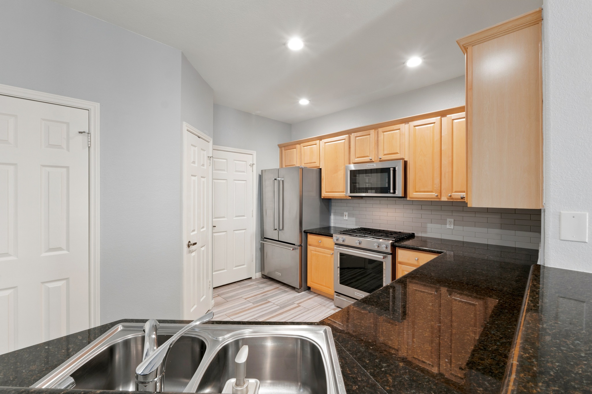 4508 Duval Road, Unit 604 Austin, TX 78727 - Photo 10 of 34 Cook up your favorite meals in this open kitchen, updated (spring 2018) with granite countertops, tile flooring, and a tile backsplash