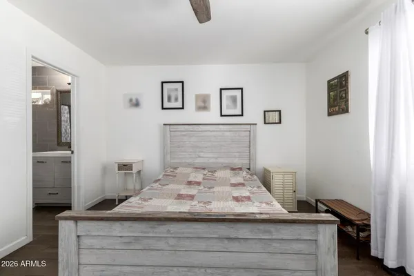 a bedroom with a bed and bathroom