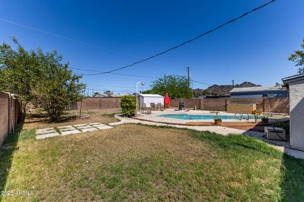 a house view with a sitting space and garden
