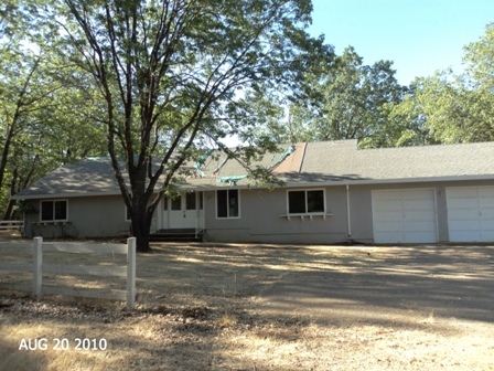 10780 Blue Mountain Ranch Road Whitmore, CA 96096 - Photo 2 of 12 a house that has a tree in front of it