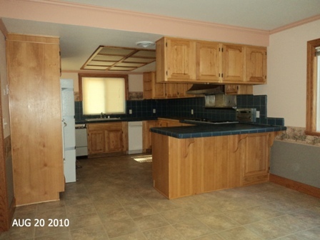 10780 Blue Mountain Ranch Road Whitmore, CA 96096 - Photo 6 of 12 a kitchen with granite countertop a sink and a stove top oven