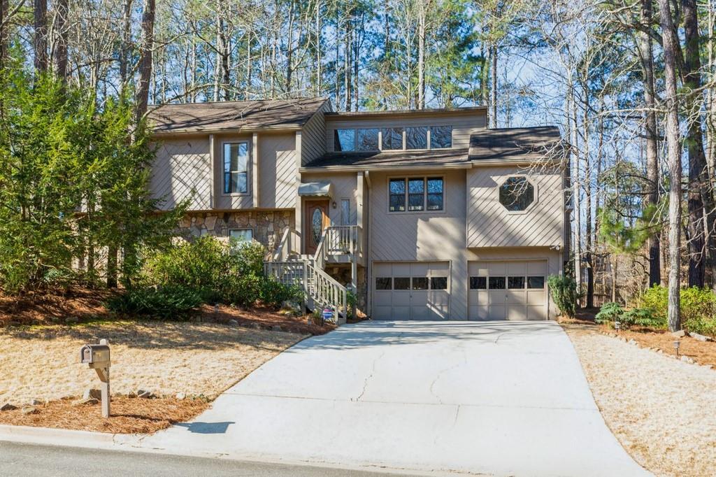 Located at a cul-de-sac, this home has a lovely wooded setting.