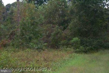 1842 Hatfield Road Huntingtown, MD 20639 - Photo 1 of 1 a view of a field of grass and trees