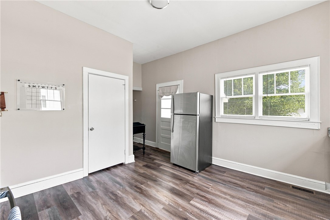 7 McCaughrin Street Pelzer, SC 29669 - Photo 22 of 24 A well-lit kitchen space features durable flooring and a functional layout.