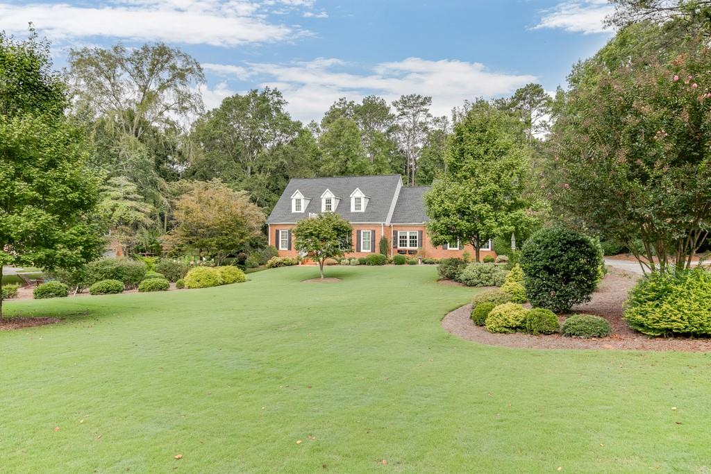 820 McDaniel Street Monroe, GA 30655 - Photo 1 of 1 a front view of a house with a garden
