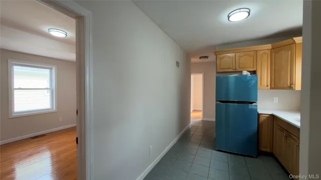 a kitchen with a refrigerator and a stove