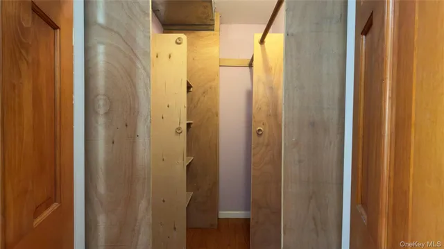 a bathroom with a glass door shower and a sink