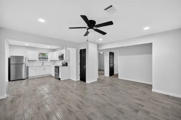 a view of a kitchen with a sink and cabinet area