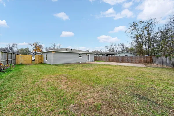 a house view with swimming pool and yard