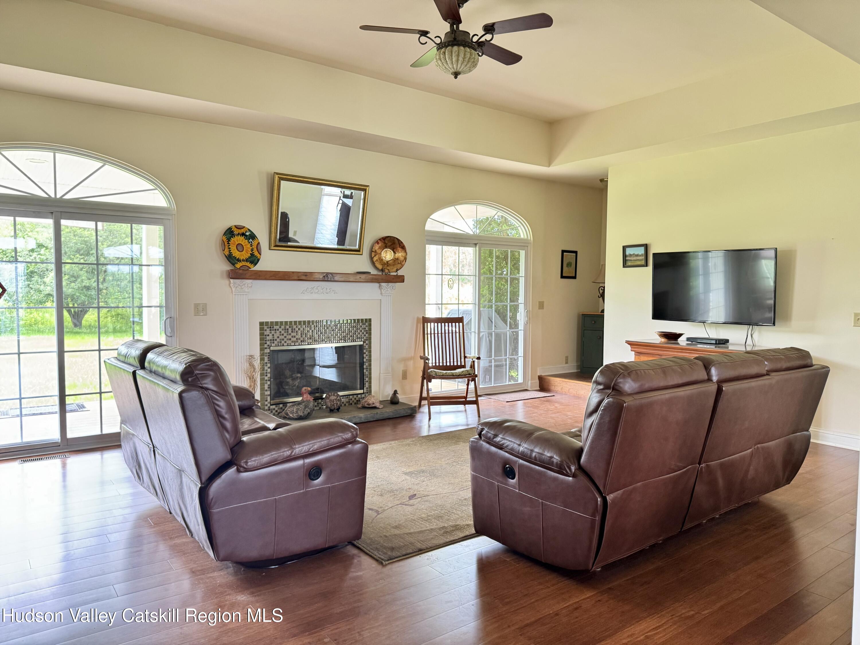 2914 Sleepy Hollow Road Athens, NY 12015 - Photo 14 of 39 a living room with furniture and a flat screen tv