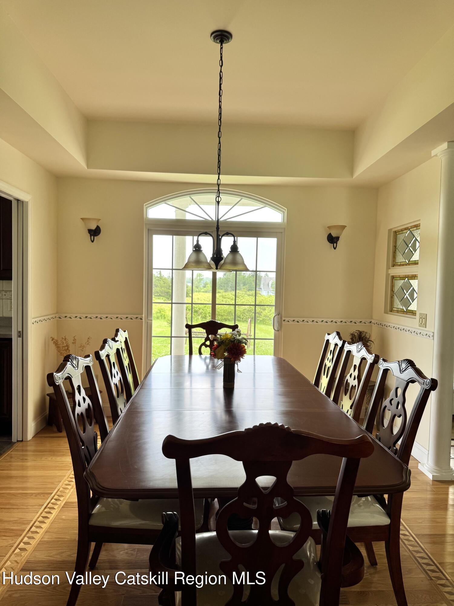 2914 Sleepy Hollow Road Athens, NY 12015 - Photo 15 of 39 a view of a dining room with furniture window and wooden floor