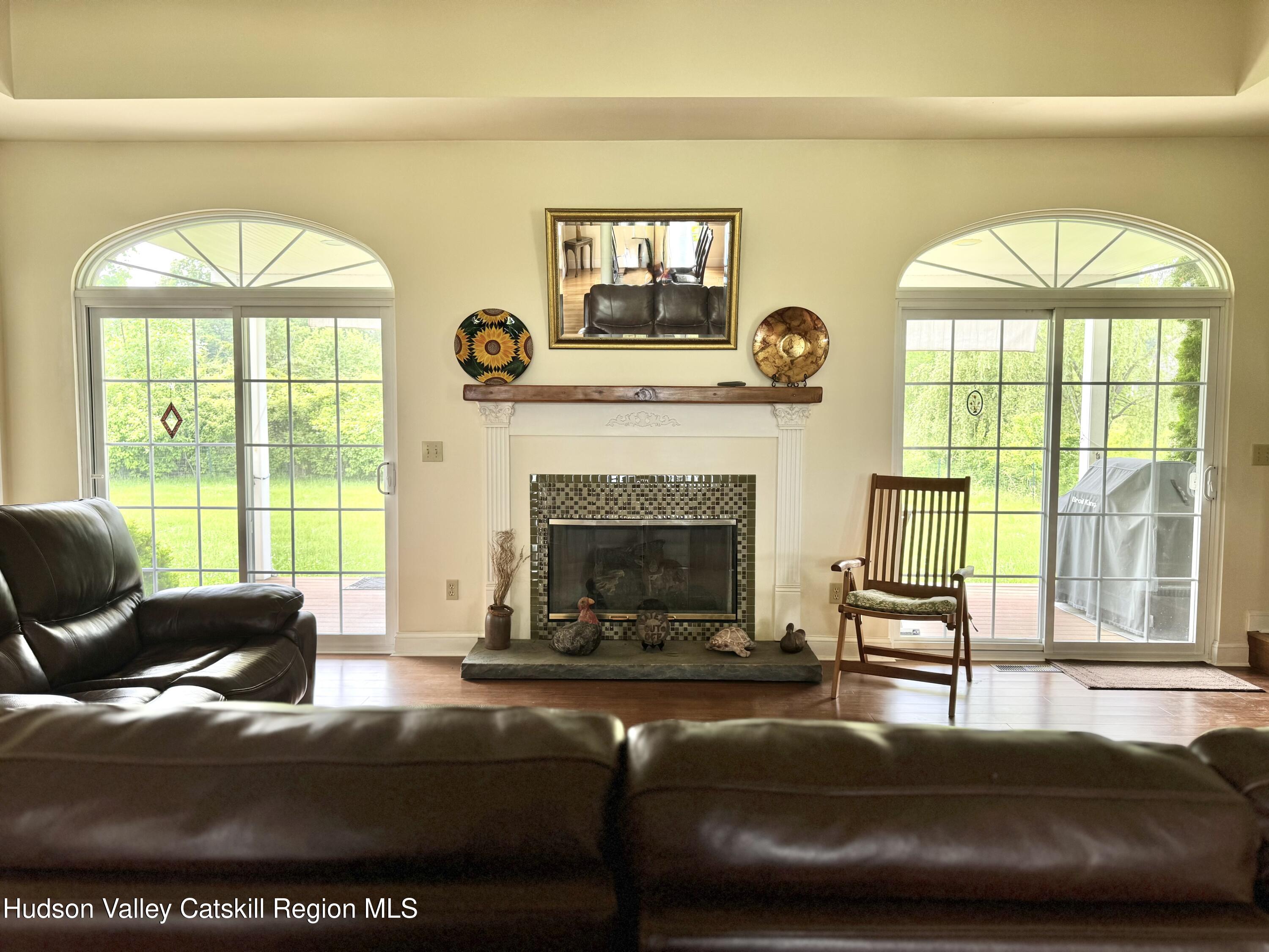 2914 Sleepy Hollow Road Athens, NY 12015 - Photo 21 of 39 a living room with furniture and a fireplace