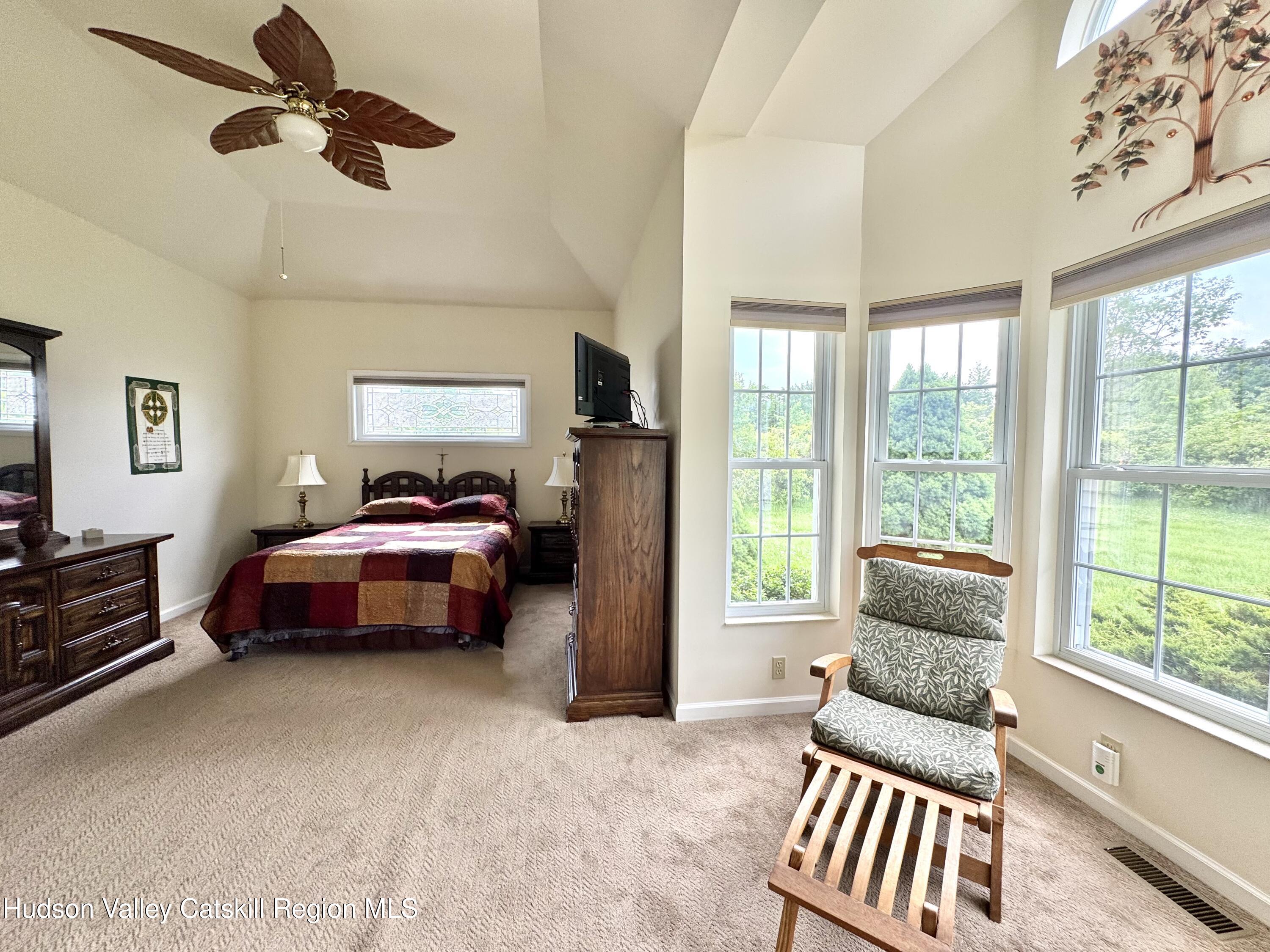 2914 Sleepy Hollow Road Athens, NY 12015 - Photo 23 of 39 a bedroom with a bed and wooden floor