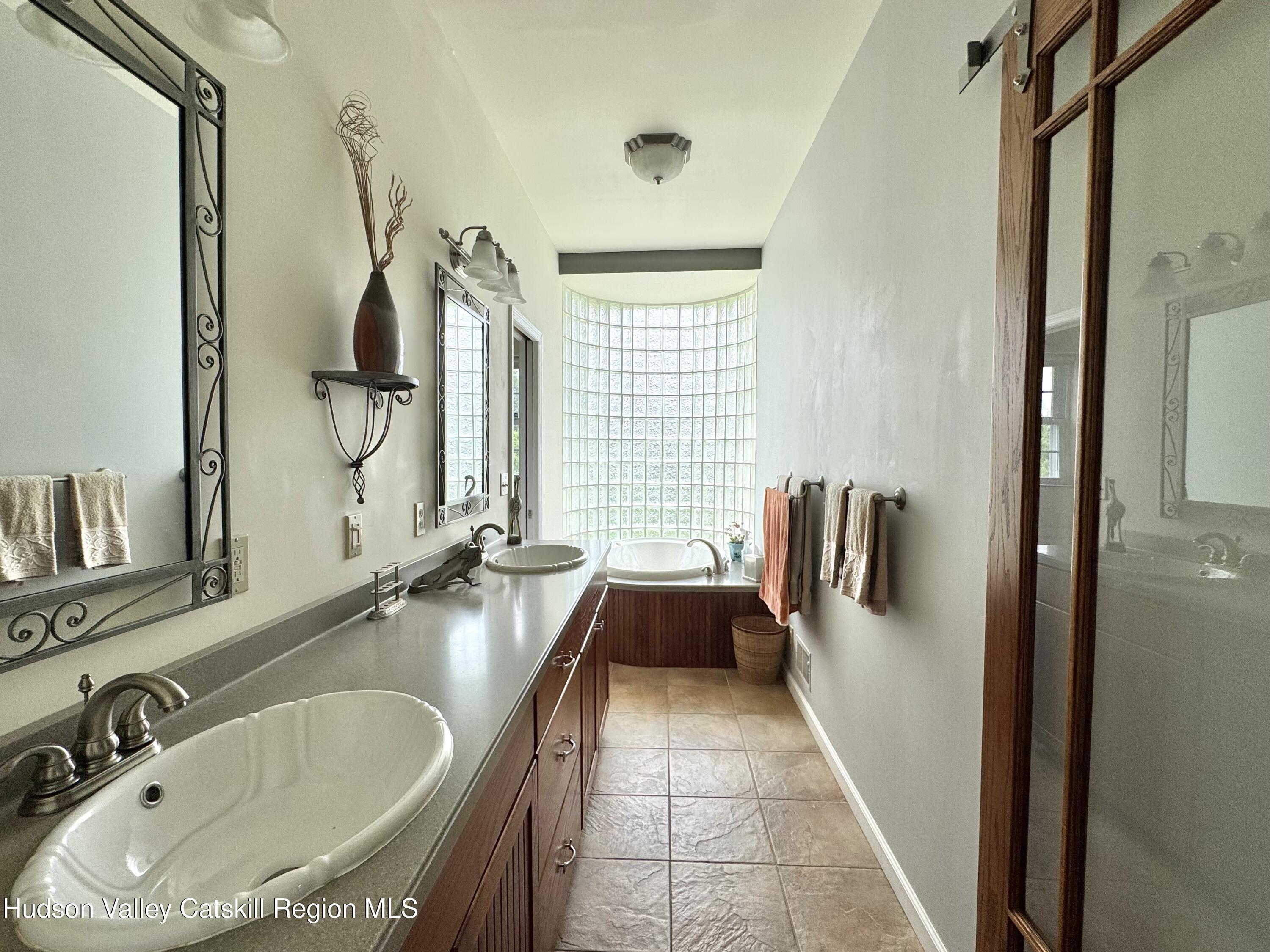 2914 Sleepy Hollow Road Athens, NY 12015 - Photo 26 of 39 a bathroom with a tub sink and mirror