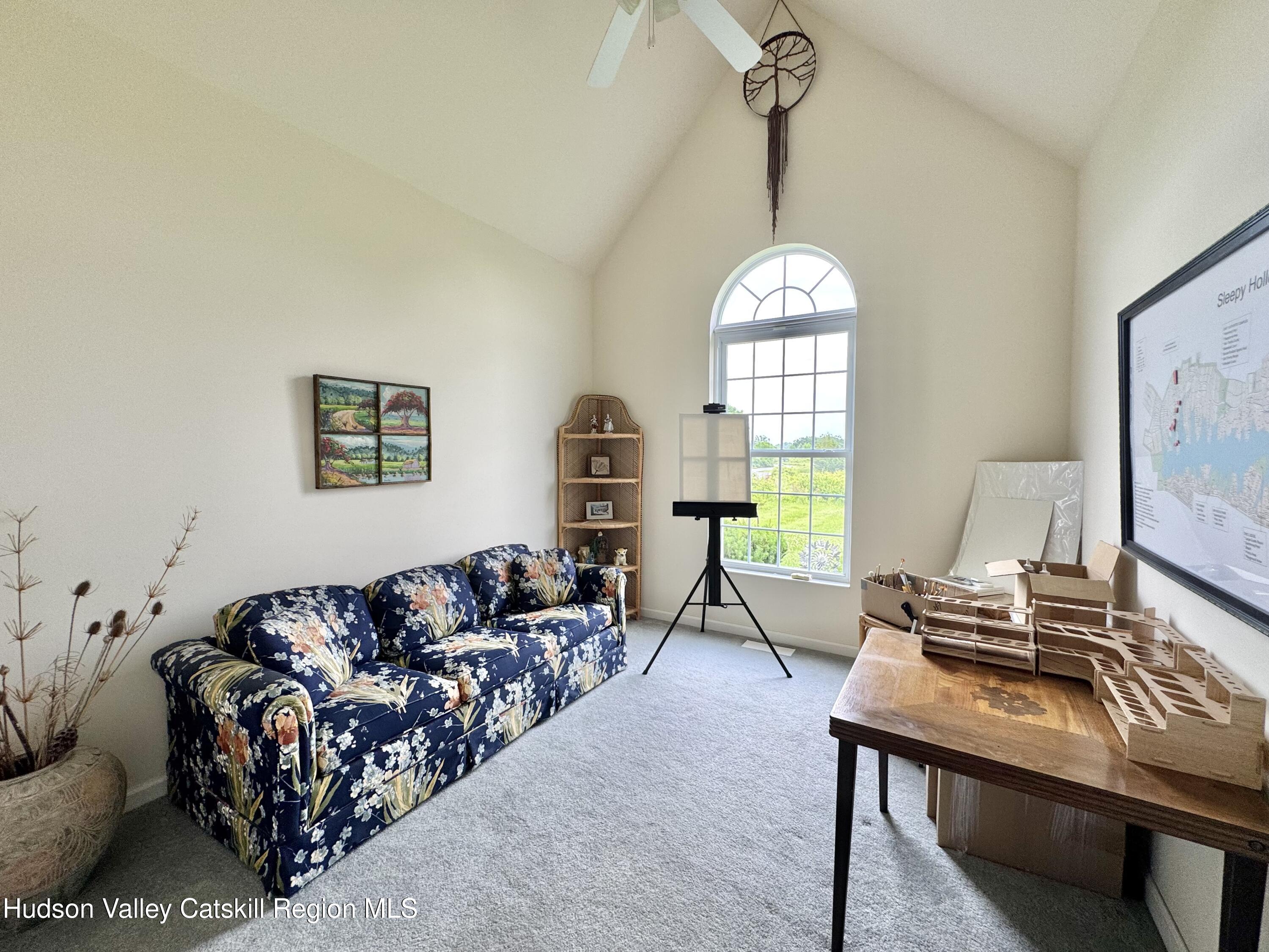 2914 Sleepy Hollow Road Athens, NY 12015 - Photo 29 of 39 a living room with furniture a table and a large window