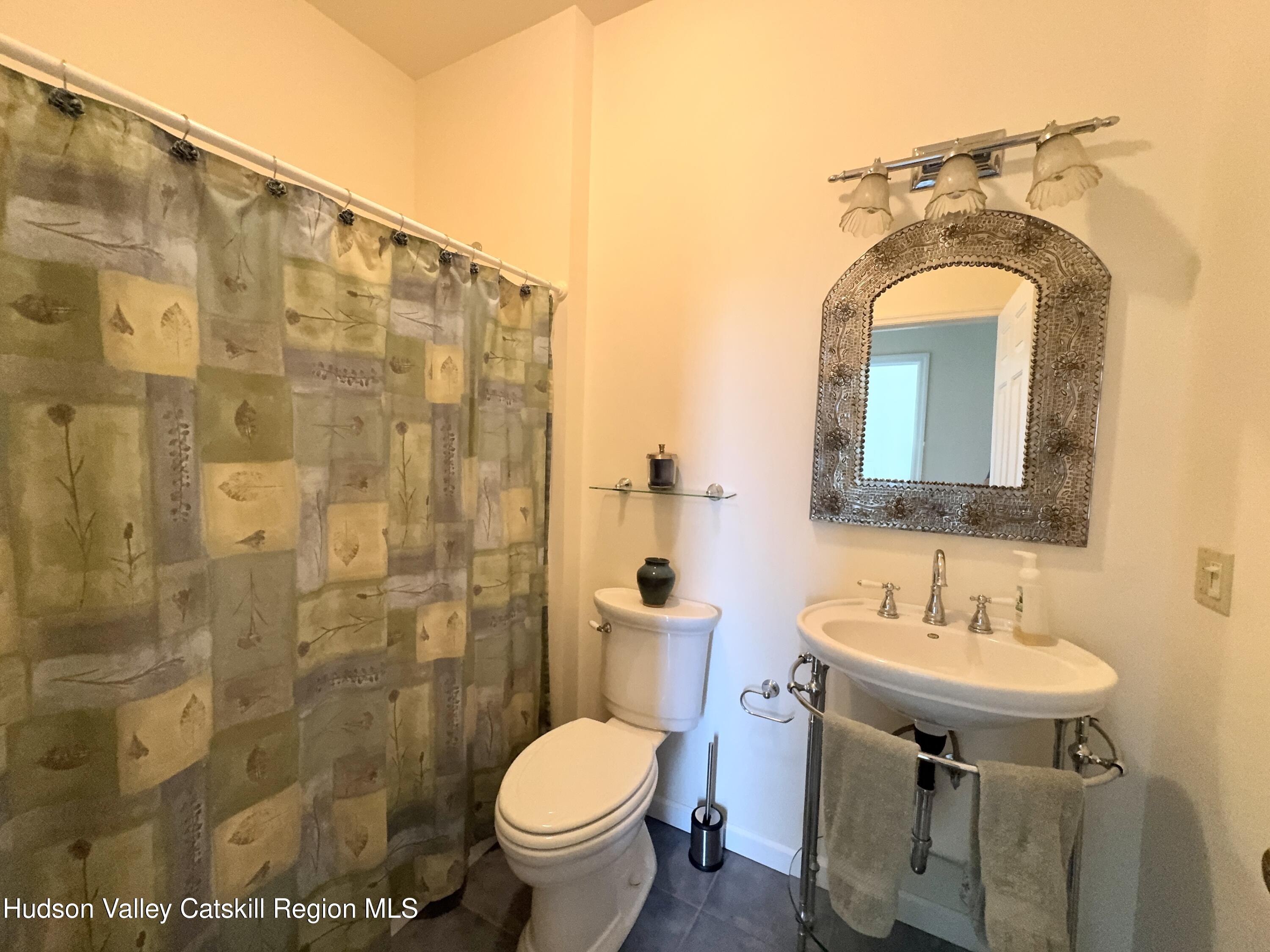 2914 Sleepy Hollow Road Athens, NY 12015 - Photo 30 of 39 a bathroom with a sink mirror toilet and shower