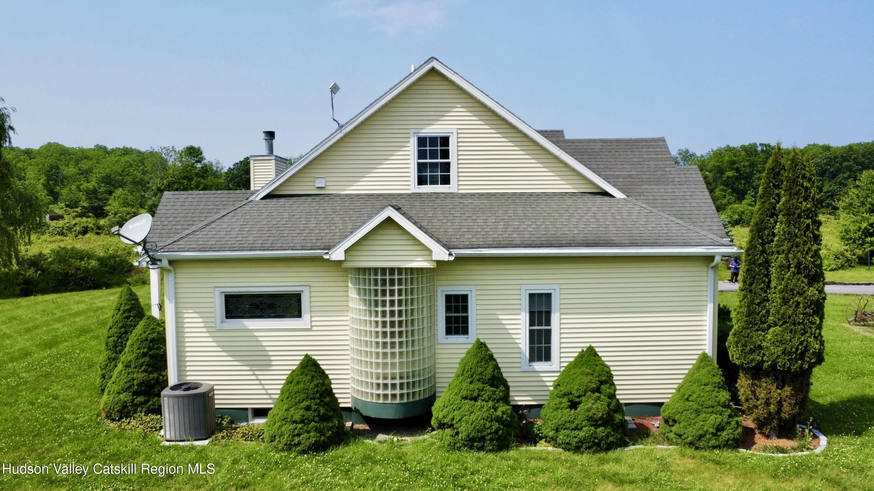 2914 Sleepy Hollow Road Athens, NY 12015 - Photo 7 of 39 a view of a house with a yard and plants